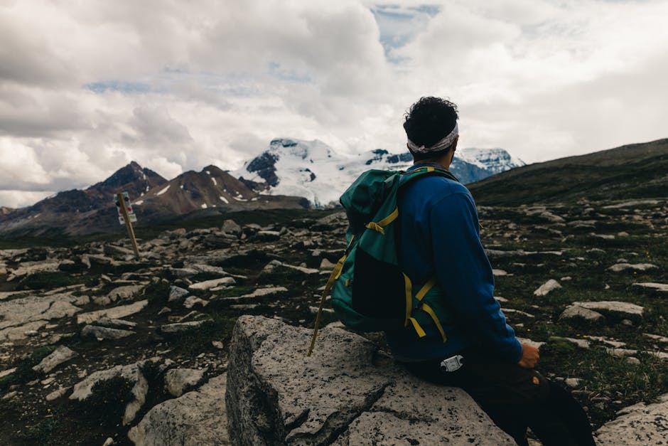 Hiker enjoying mountainous views in Jasper National Park, Alberta.