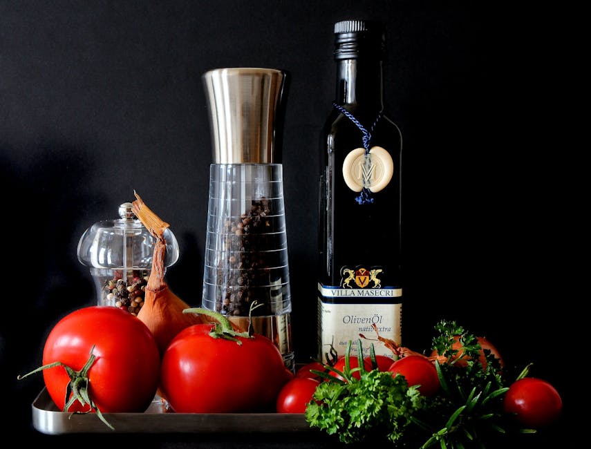 Vibrant display of fresh ingredients featuring tomatoes, herbs, and olive oil for healthy cooking.