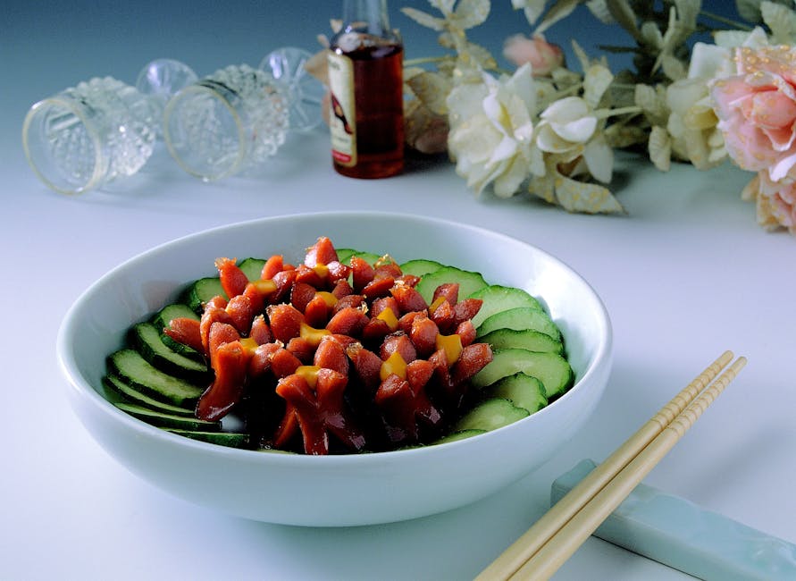 Vibrant salad bowl featuring sausages and cucumber slices, perfect for a nutritious meal